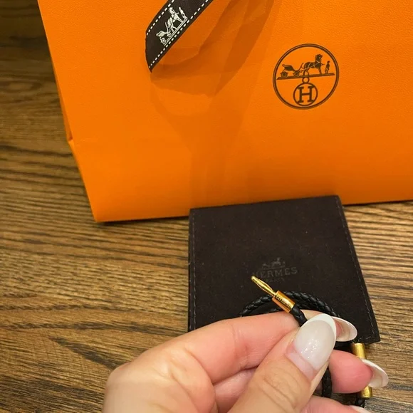 Authentic Hermes’ men’s Tournis Tresse bracelet in black leather gold hardware - Picture 4 of 5